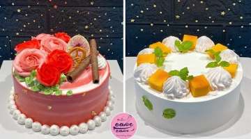 Decorate a pure white birthday cake with mint leaves and mango